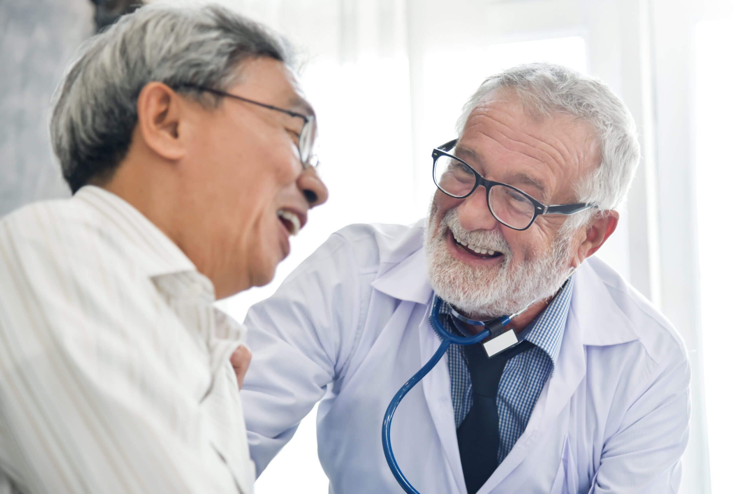 Happiness of Senior male Doctor with Asian male patient.